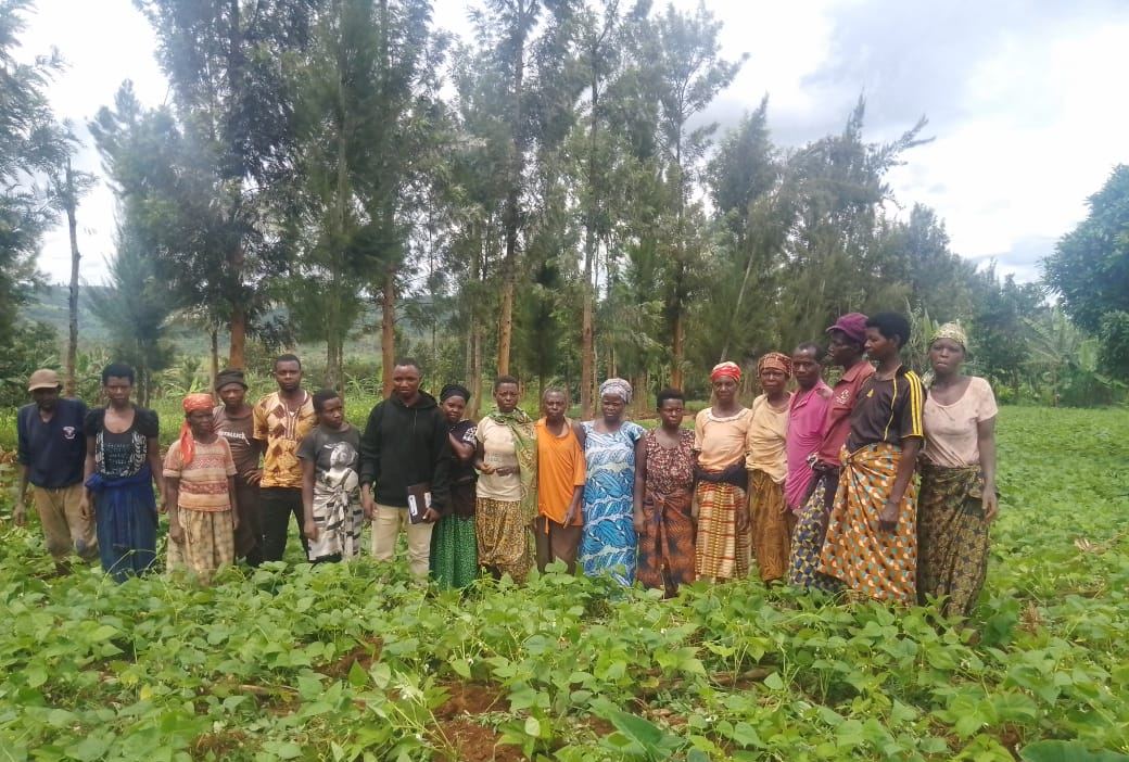 A group of farmers standing together in their field